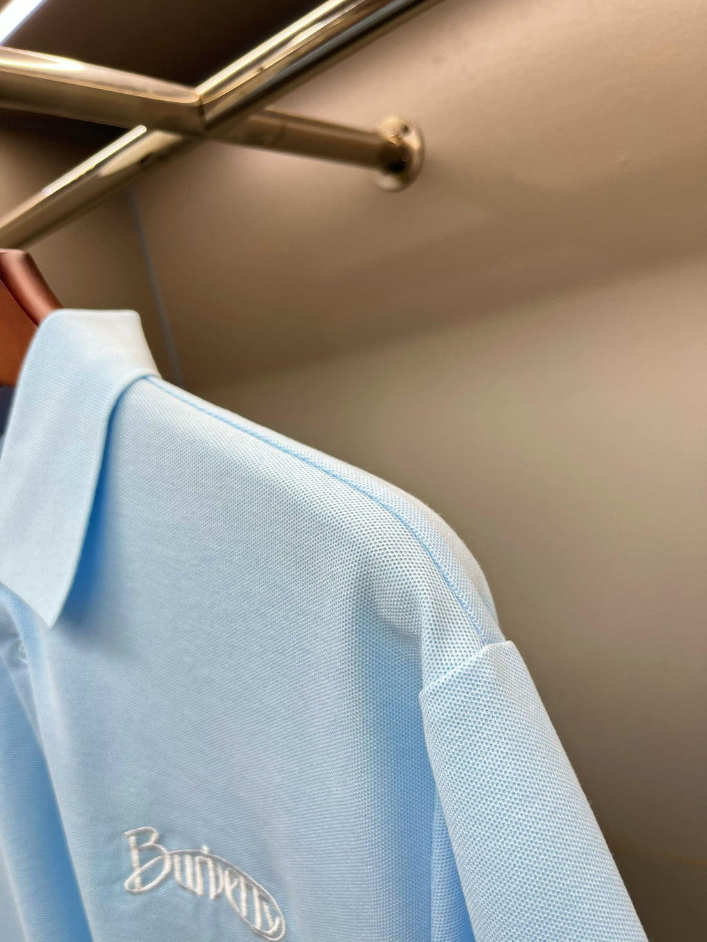 Burberry light blue polo shirt sleeve and shoulder seam with embroidered logo detail