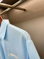 Burberry light blue polo shirt sleeve and shoulder seam with embroidered logo detail