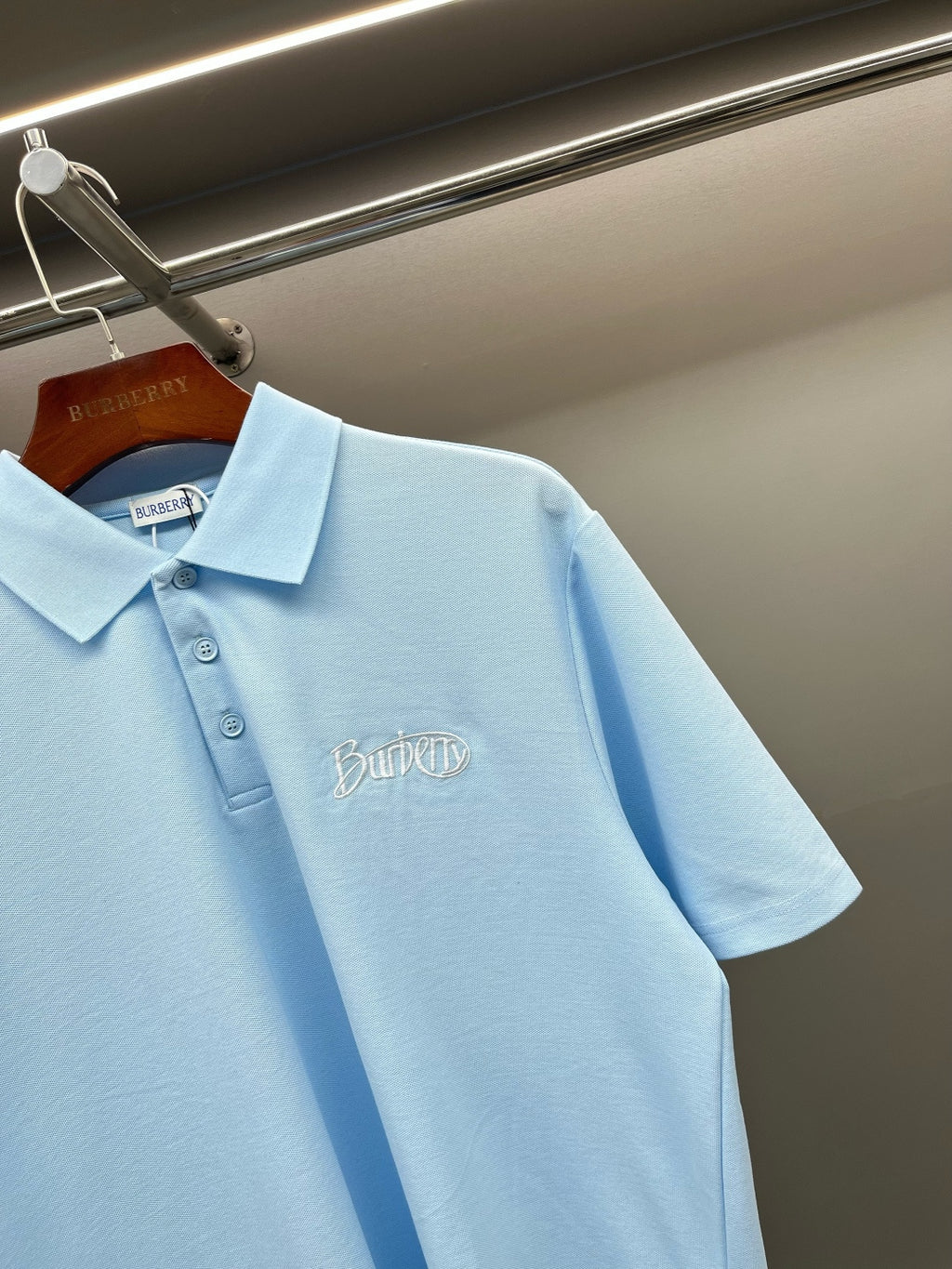 Burberry light blue short-sleeve polo shirt with embroidered logo on the chest