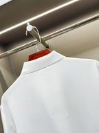 Burberry white short-sleeve polo shirt close-up of back collar and upper back