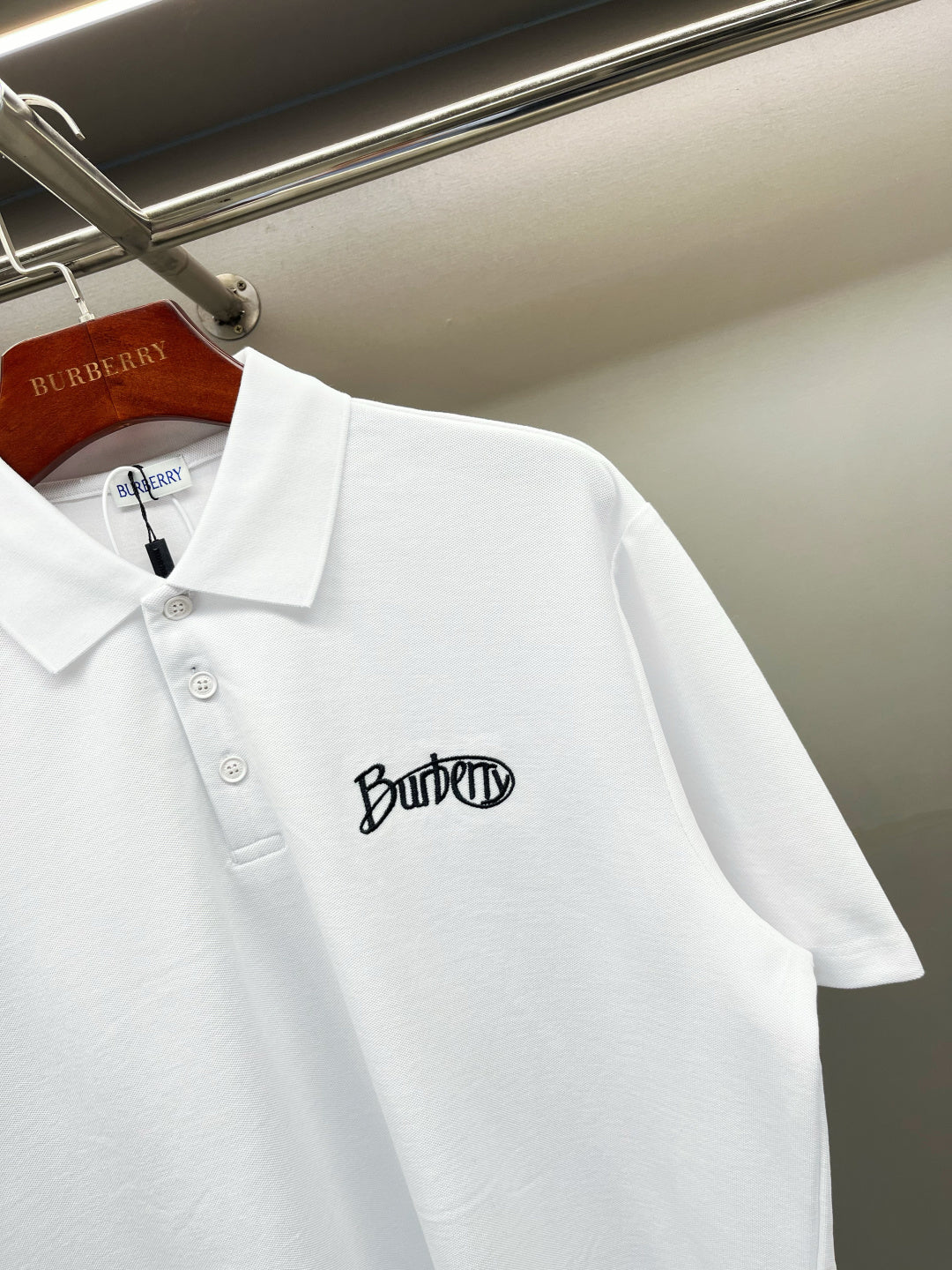 Burberry white short-sleeve polo shirt with chest logo, button placket detail