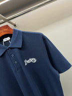 Navy Burberry polo shirt with chest logo, short sleeves, button placket