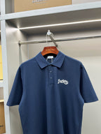Blue Burberry polo shirt on hanger, short sleeves, button placket, chest logo