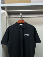 Dark navy short-sleeve polo shirt with button placket and embroidered Burberry logo