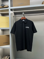 Dark navy short-sleeve polo shirt with pointed collar and Burberry chest logo