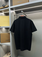 Dark navy short-sleeve polo shirt on hanger, plain back view