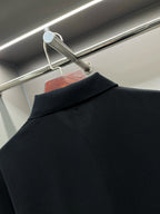Burberry polo collar and neckline on dark navy shirt