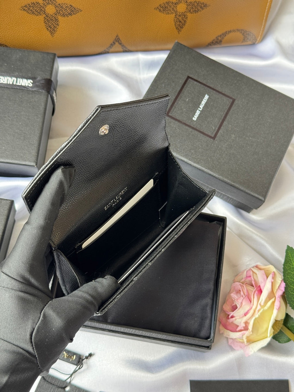 Dark small bag opened to show interior and card slots