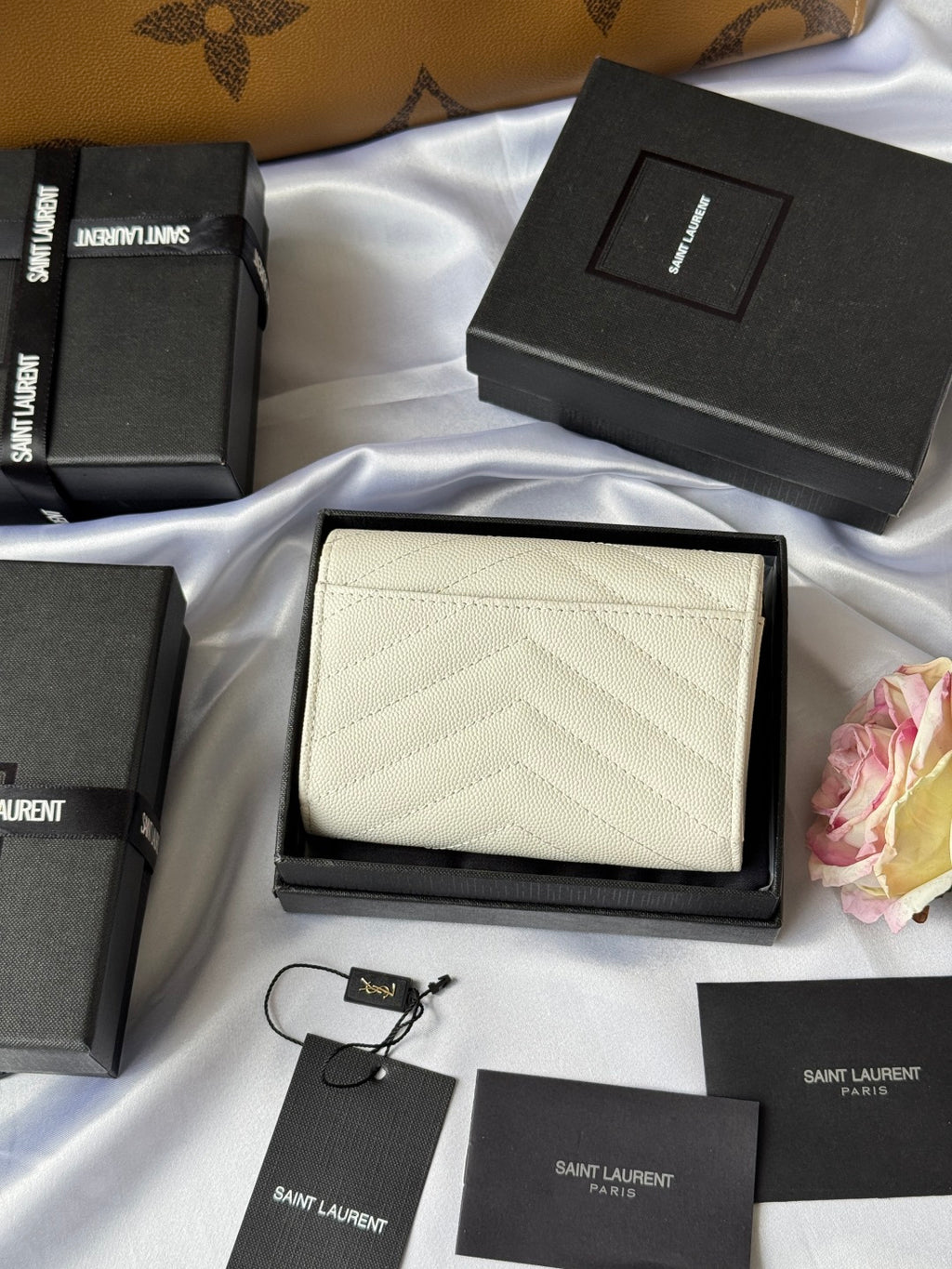 Small bag in light cream with chevron quilting and gold Saint Laurent logo