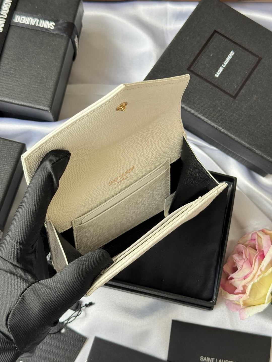 Small bag in light cream with flap opening and gold Saint Laurent logo