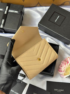 Small bag wallet in light yellow textured leather with flap and gold button detail