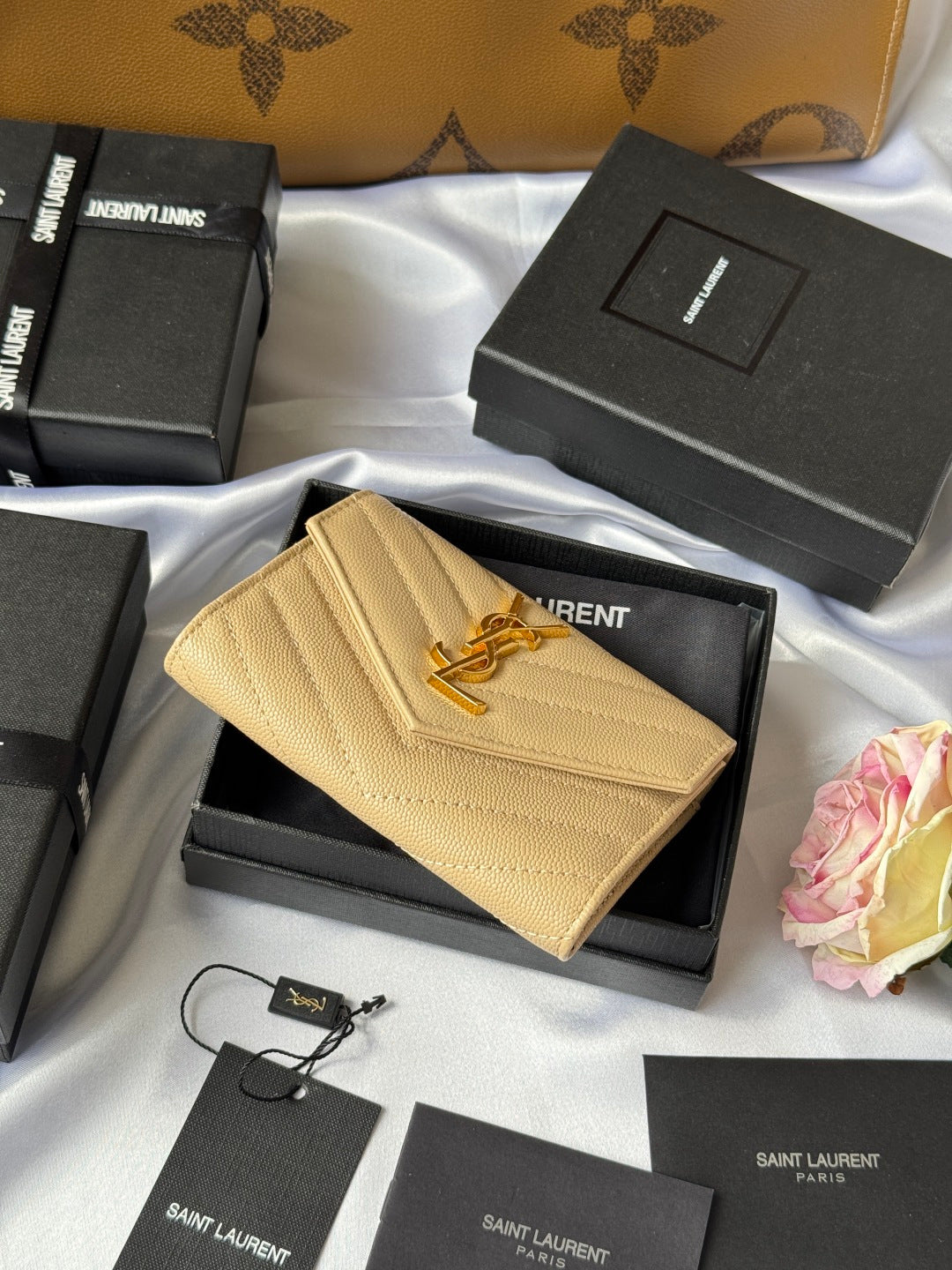 Small bag wallet in light yellow textured leather, YSL logo on flap, front view