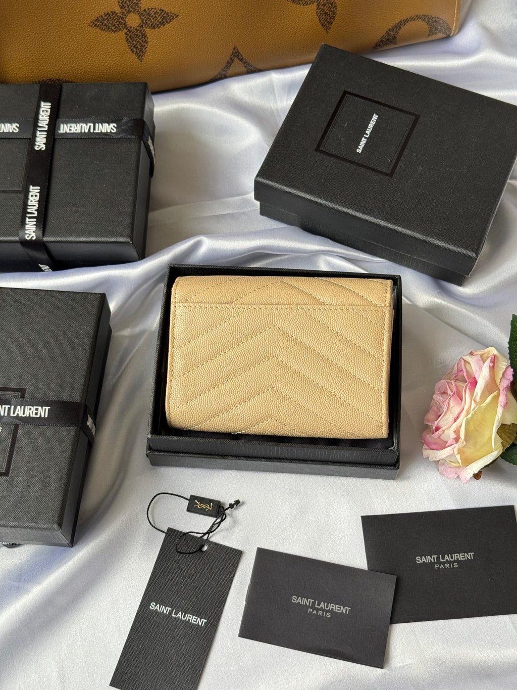 Small bag wallet in light yellow textured leather with YSL logo and long chain