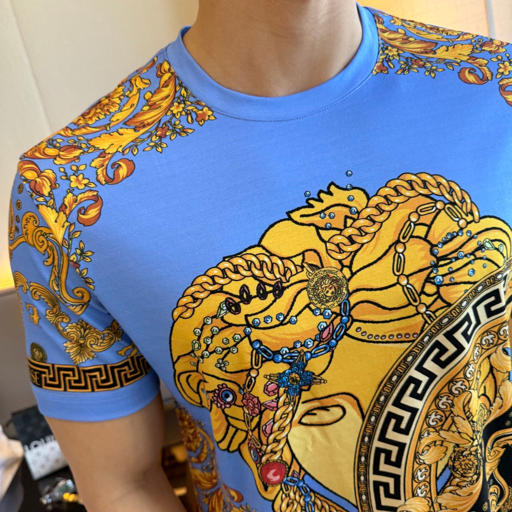 Versace short-sleeve T-shirt close-up of blue fabric with gold and black baroque graphic