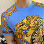 Versace short-sleeve T-shirt close-up of blue fabric with gold and black baroque graphic