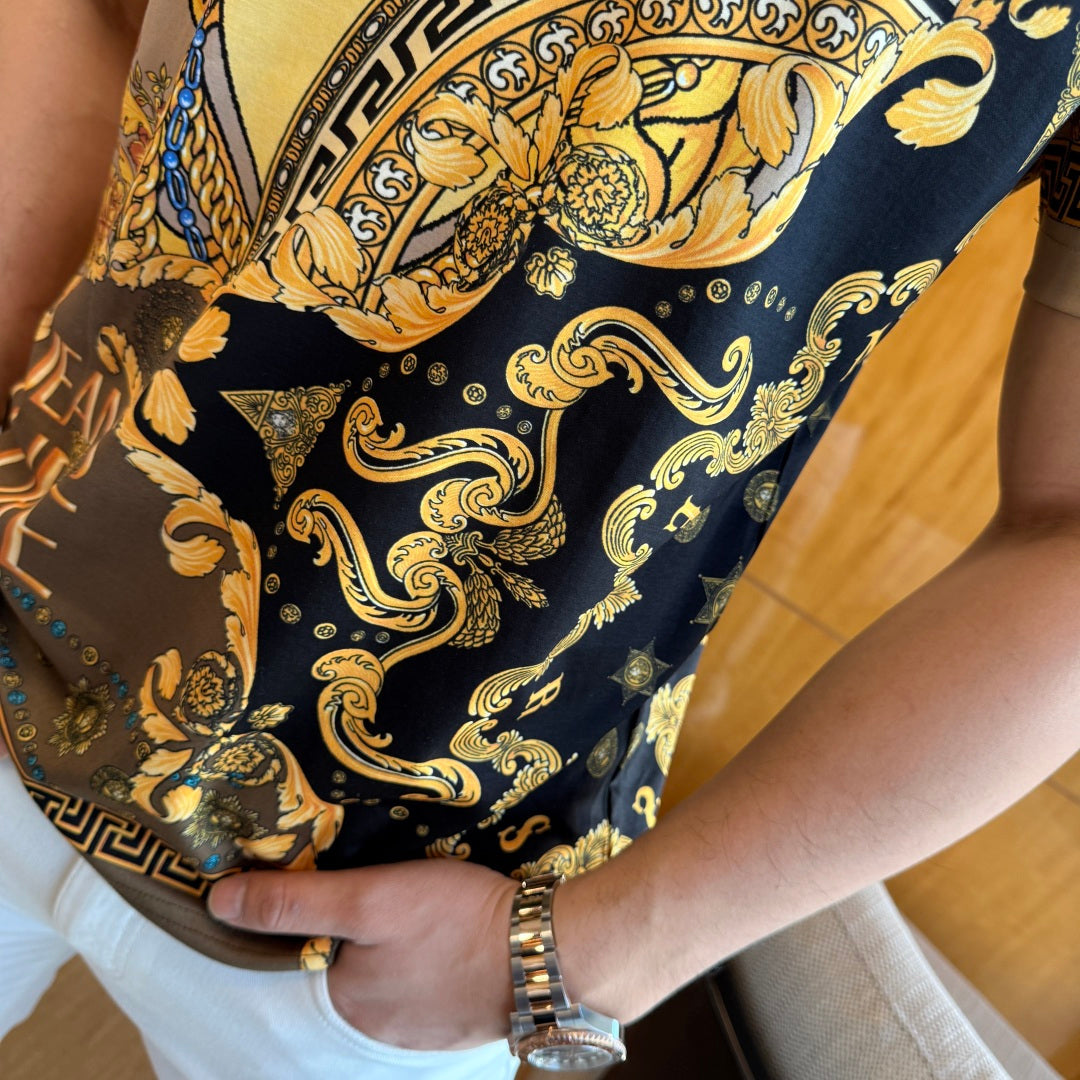 Versace T-shirt side view with dark navy and gold baroque pattern near hem