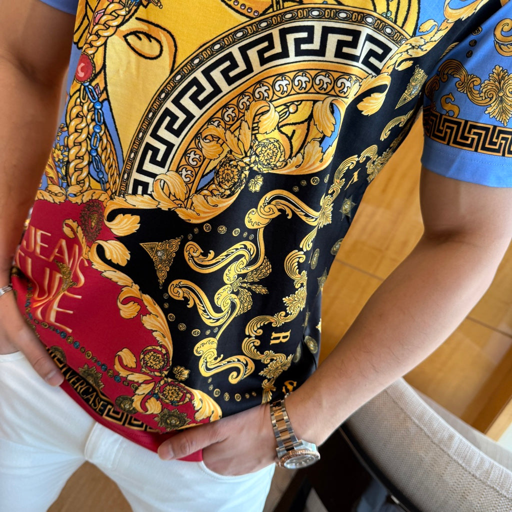 Versace short-sleeve T-shirt close-up of black background with gold curls and red accents