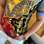 Versace short-sleeve T-shirt close-up of black background with gold curls and red accents