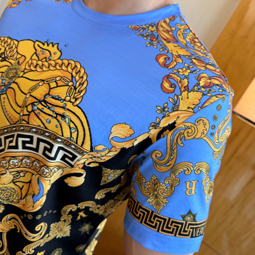 Versace short-sleeve T-shirt side view with blue swirl pattern and partial Greek border