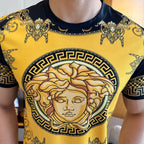 Gold and black T-shirt with large portrait print at center, short sleeves