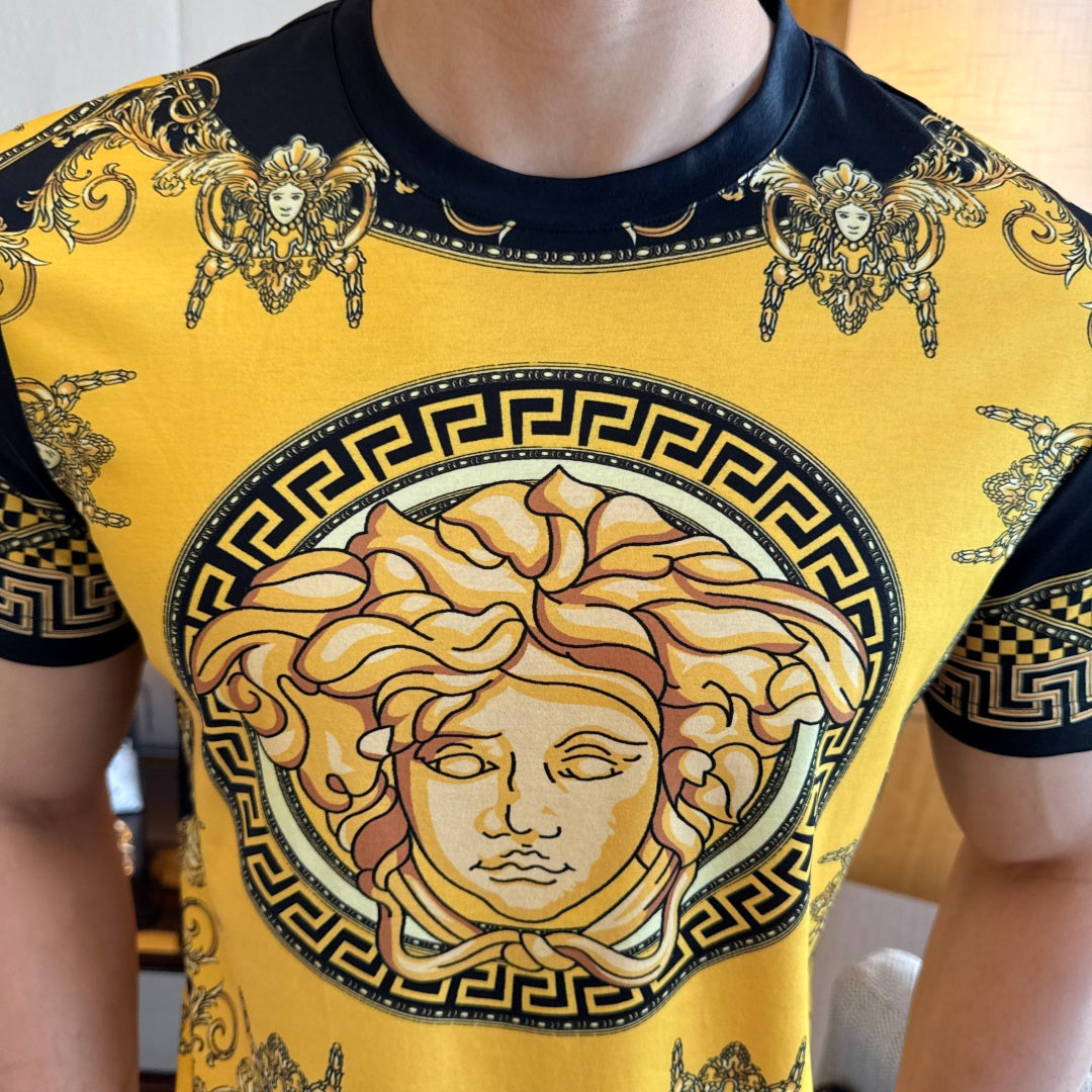 Gold and black T-shirt with large portrait print at center, short sleeves