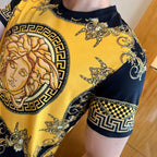 Gold and black T-shirt with winged baroque motifs and Greek key check sleeve cuff