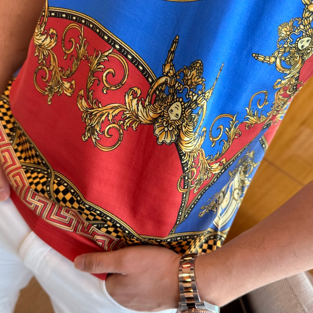 Versace T-shirt hem detail with red-and-blue baroque print and patterned border