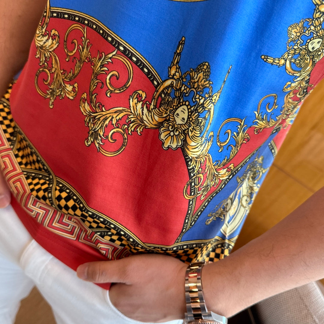 Versace T-shirt hem detail with red-and-blue baroque print and patterned border