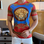 Versace T-shirt with blue print panel, red hem, and large gold face medallion