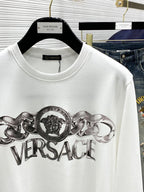 Versace white crewneck T-shirt close-up of metallic Versace logo graphic