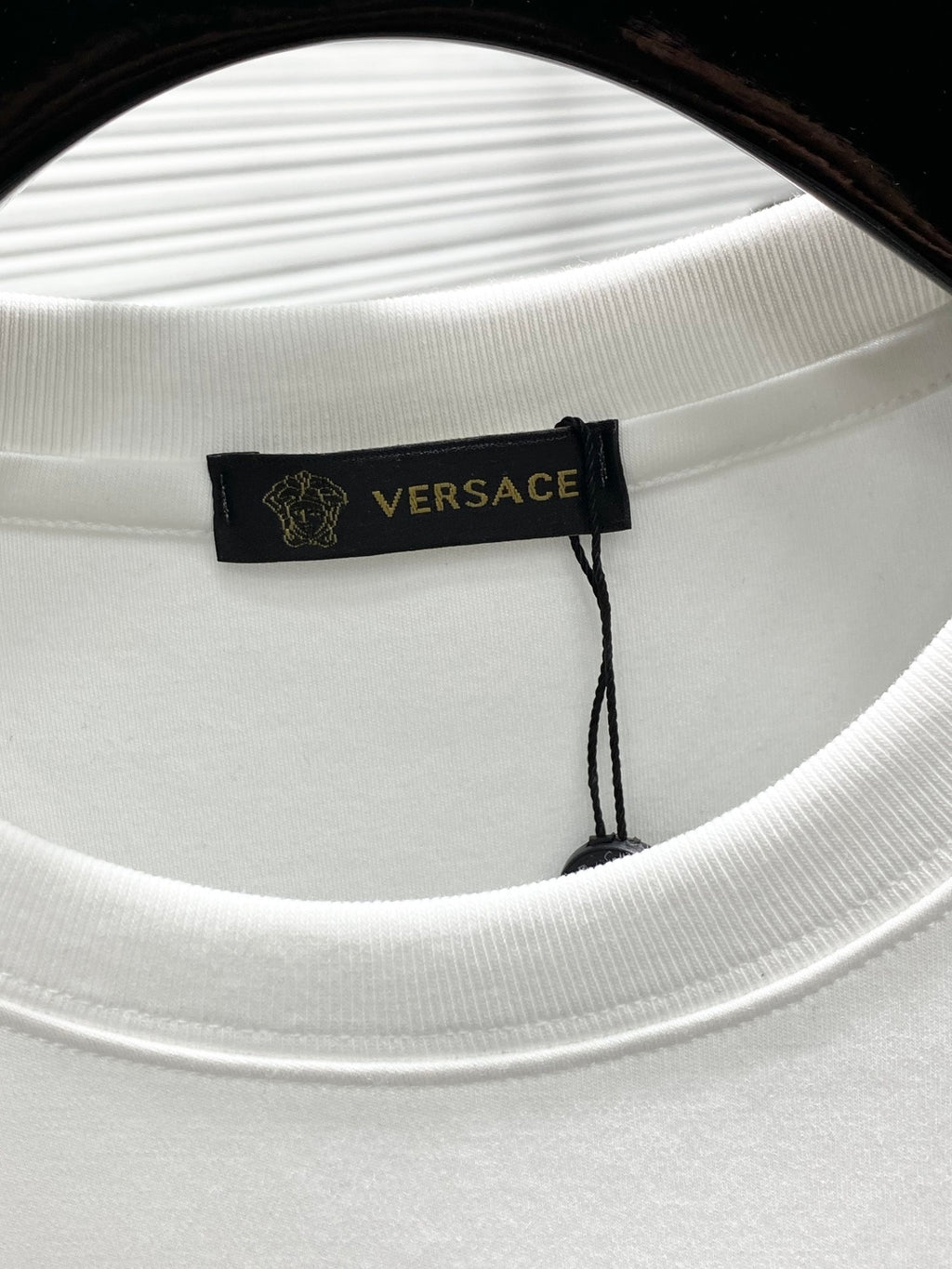 Versace white crewneck T-shirt neckline with Versace logo label detail
