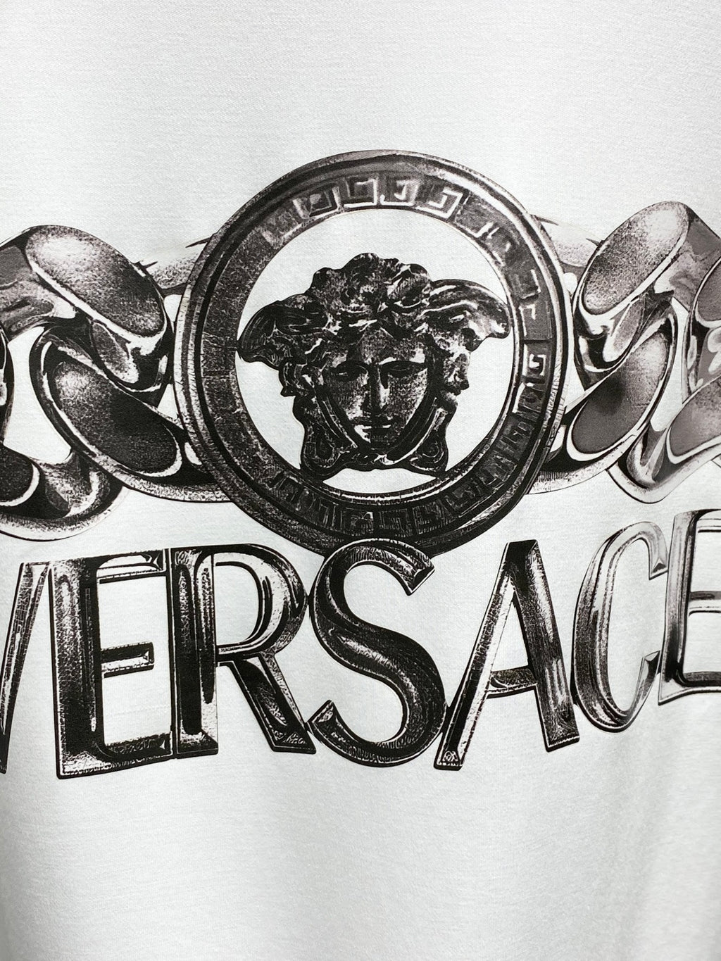 Versace white crewneck T-shirt close-up of lion crest medallion logo