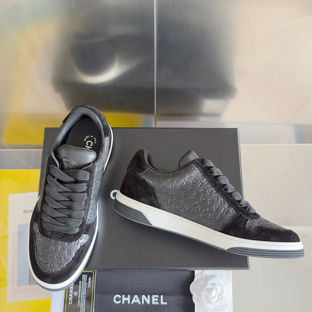 Black Chanel low-top lace sneakers, suede toe, textured logo side panel