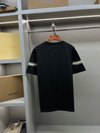 Black short-sleeve T-shirt back with green-and-white stripe band near shoulders