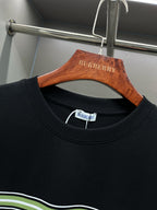 Black crew-neck T-shirt with Burberry label at collar and green-white stripe trim