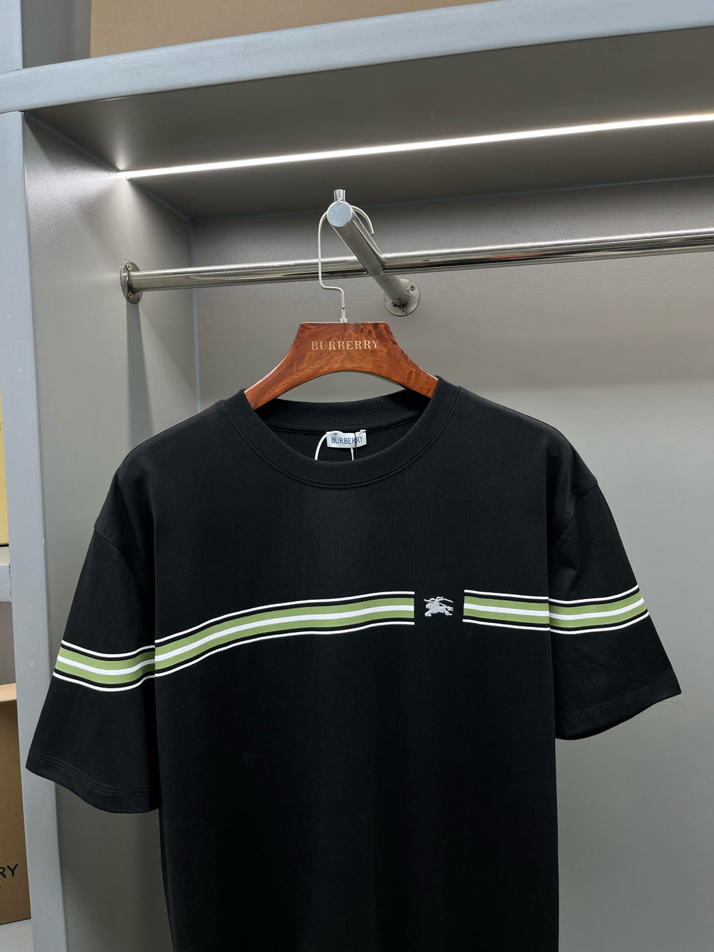 Black Burberry crew-neck T-shirt with green-and-white stripe band across chest