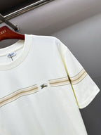 White Burberry T-shirt close-up of gold stripe band and small chest logo