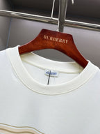 White Burberry T-shirt close-up of ribbed crew neck and gold stripe band