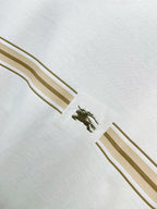 White Burberry T-shirt close-up of gold stripe sleeve trim and small logo