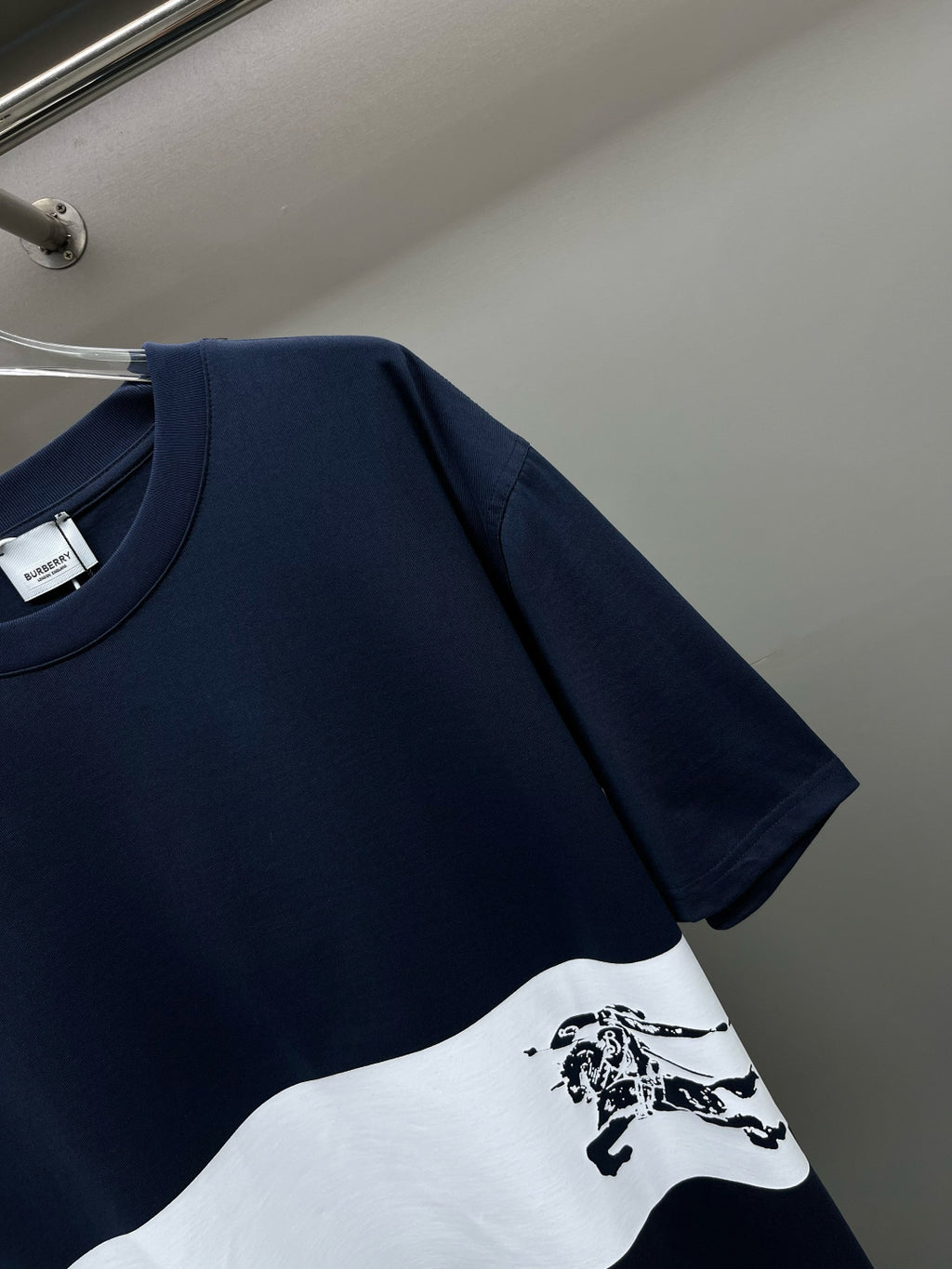 Burberry short-sleeve T-shirt with navy shoulders, white front stripe and horse print