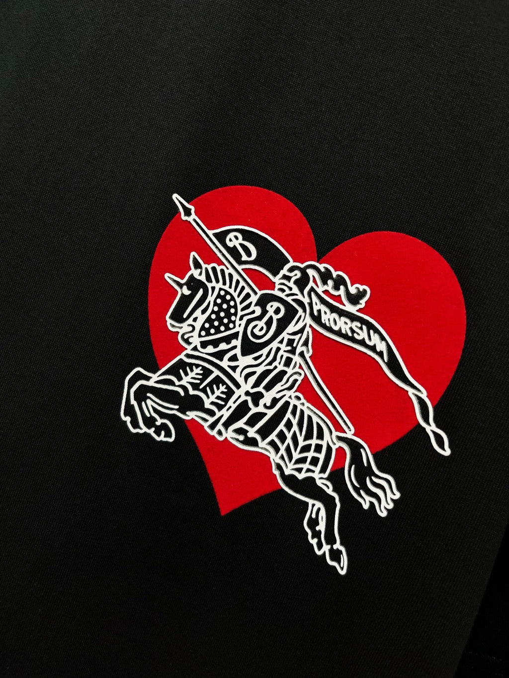 Black T-shirt with large red heart and white horse-and-rider graphic