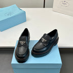 Black Prada unisex loafers, side view with strap and triangular logo
