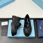 Black Prada unisex loafers, side and heel views showing rugged tread sole