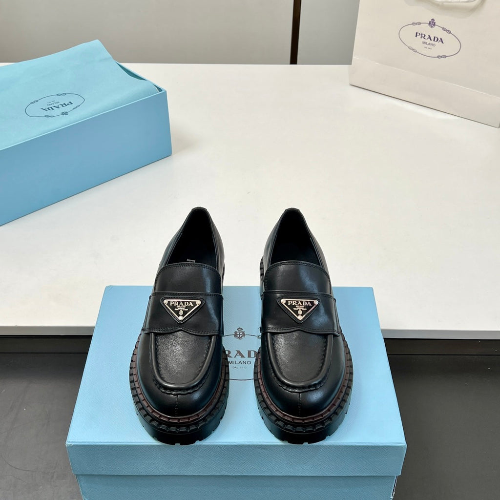 Black Prada unisex loafers with strap and triangular logo, thick platform sole