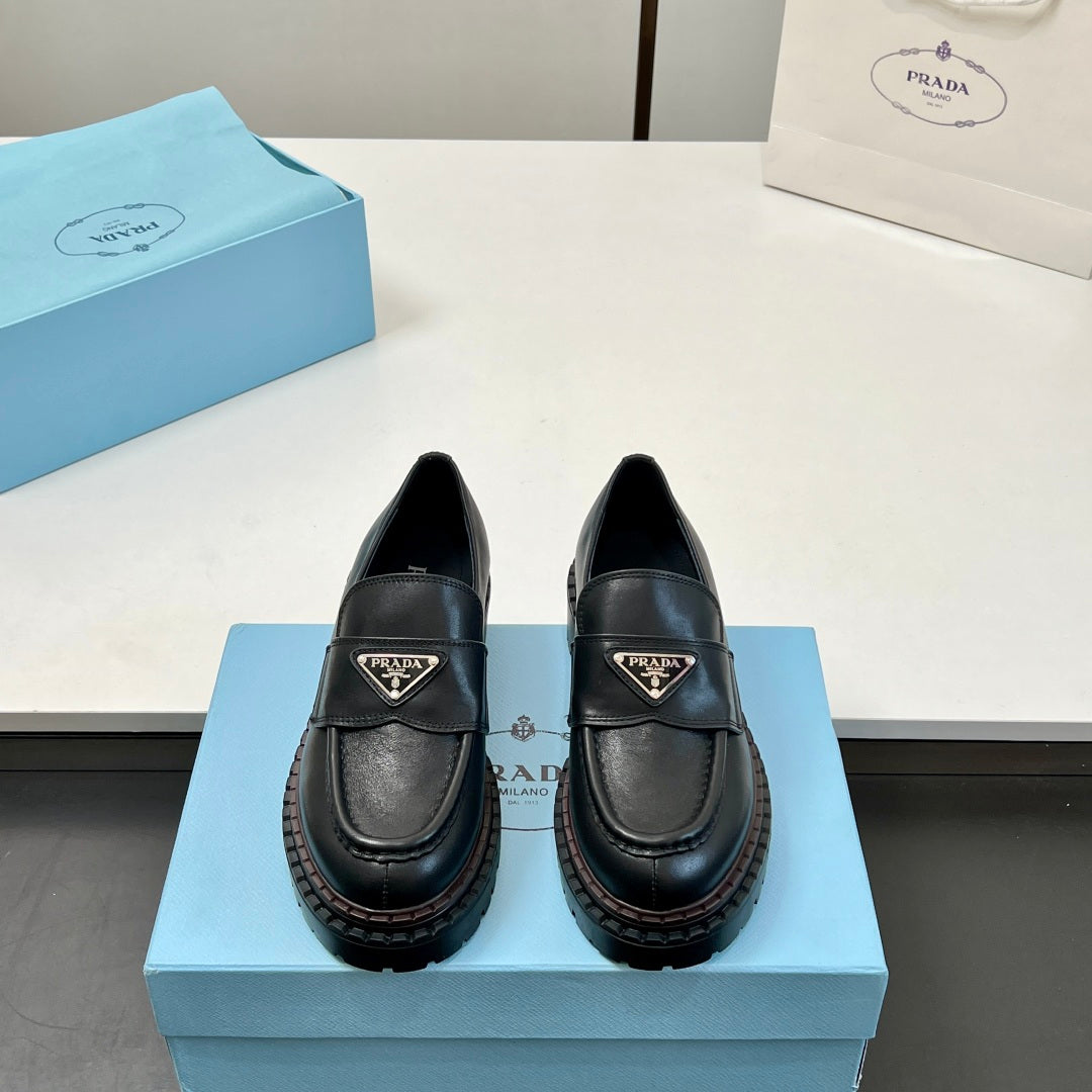 Black Prada unisex loafers with strap and triangular logo, thick platform sole