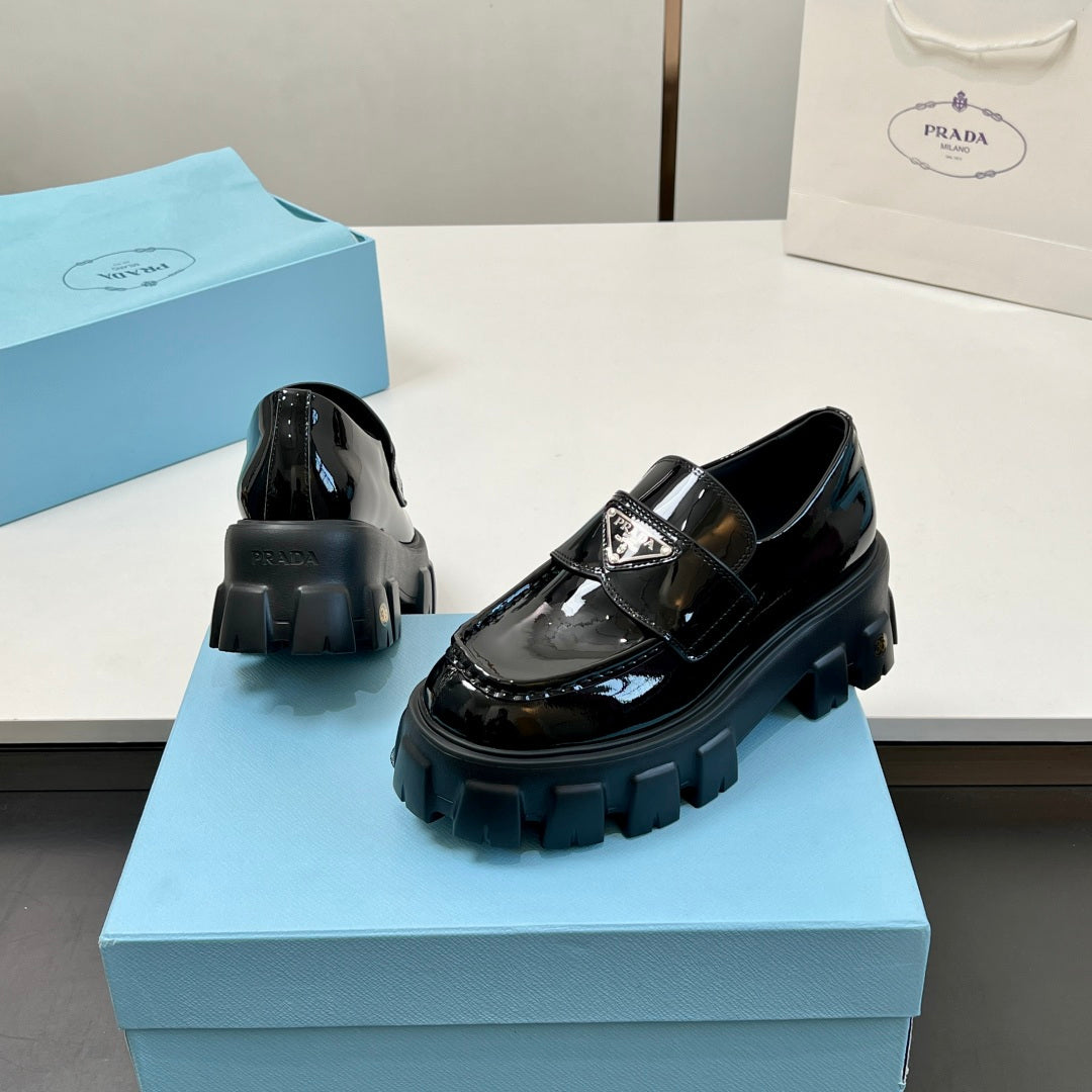 Black patent leather loafers, side and heel view with chunky platform tread
