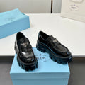 Black patent leather loafers with chunky platform sole, side buckle, unisex style