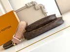 Louis Vuitton crossbody bag with monogram canvas and slim wrist strap with gold zipper pull