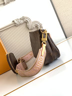 Louis Vuitton crossbody bag in monogram canvas with gold hardware and strap detail