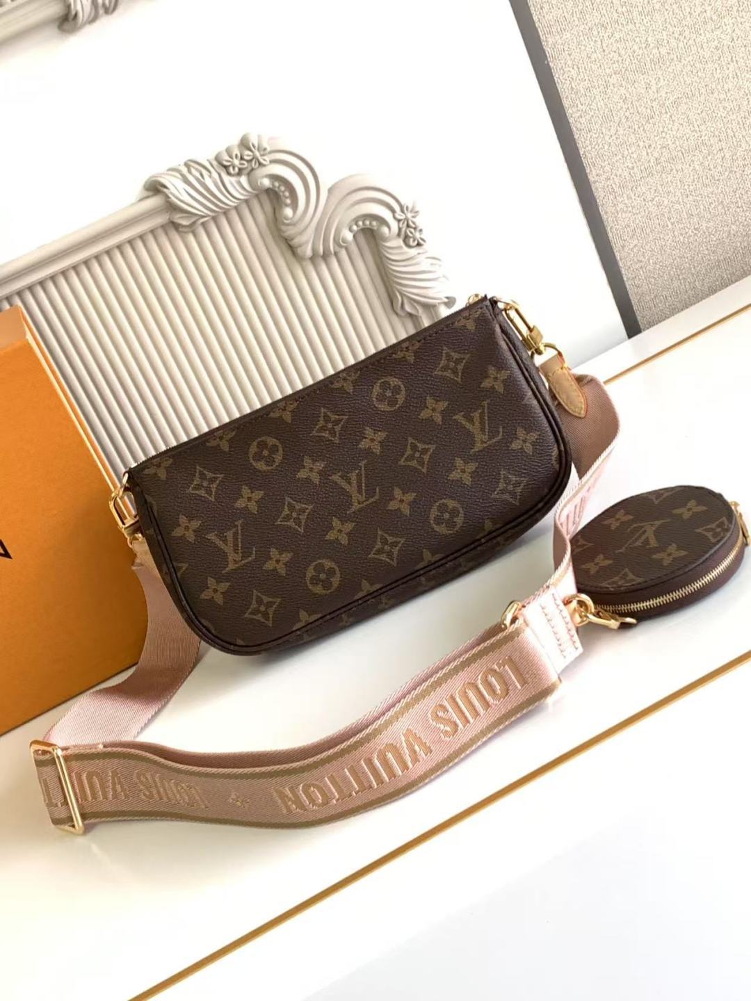 Louis Vuitton crossbody bag with monogram print, adjustable strap, and gold clasp